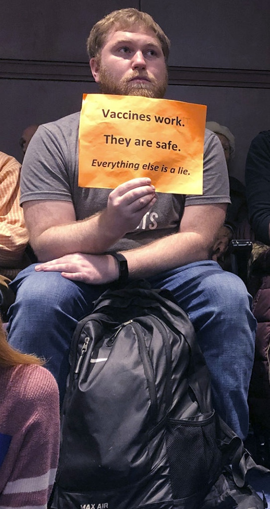 Vaccines work.  They are safe.  Everything else is a lie.
A supporter of vaccinations holds up a sign while watching a public hearing on vaccine exemption legislation on closed-circuit television, in an overflow room at the Connecticut Legislative Office Building in Hartford, Feb. 19, 2020.