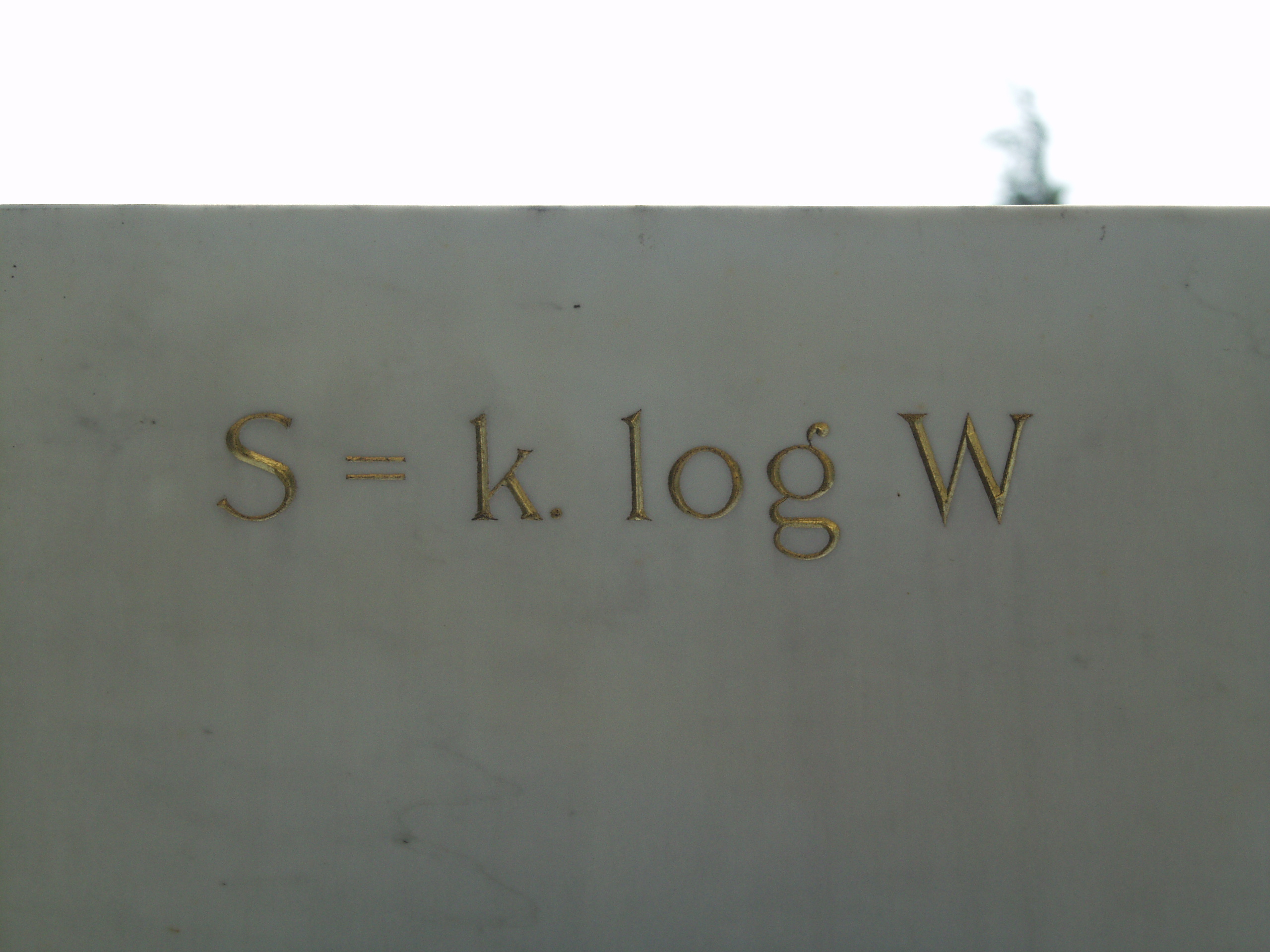 
Vienna, Austria.
Boltzmann's Tomb in the Zentralfriedhof (Central Cemetary).
The Tomb is in Gruppe 14 C Grab No 1 (group 14 grave number 1).
Photos by
Tom Schneider or of him by Gerd Muller.
2002 July 14.
This image: The famous engravement on the Tomb: S = k. log W.
(a href =
